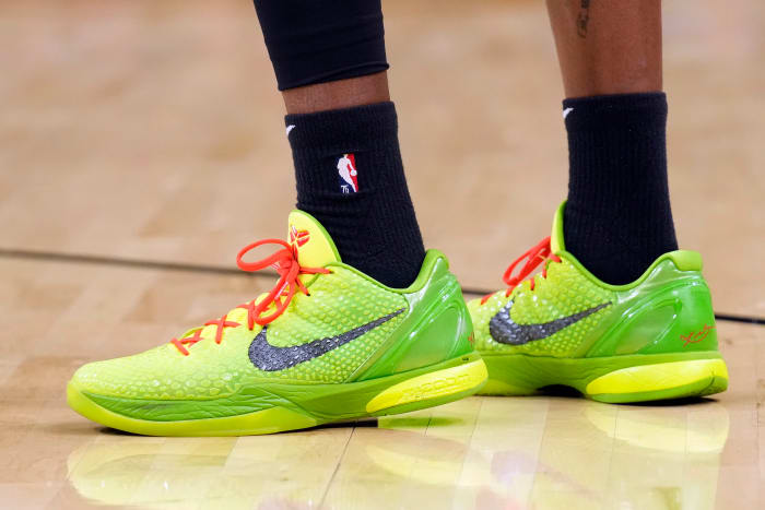 View of green Nike Kobe shoes.